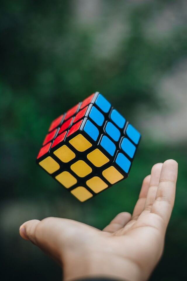 Man tossing cube